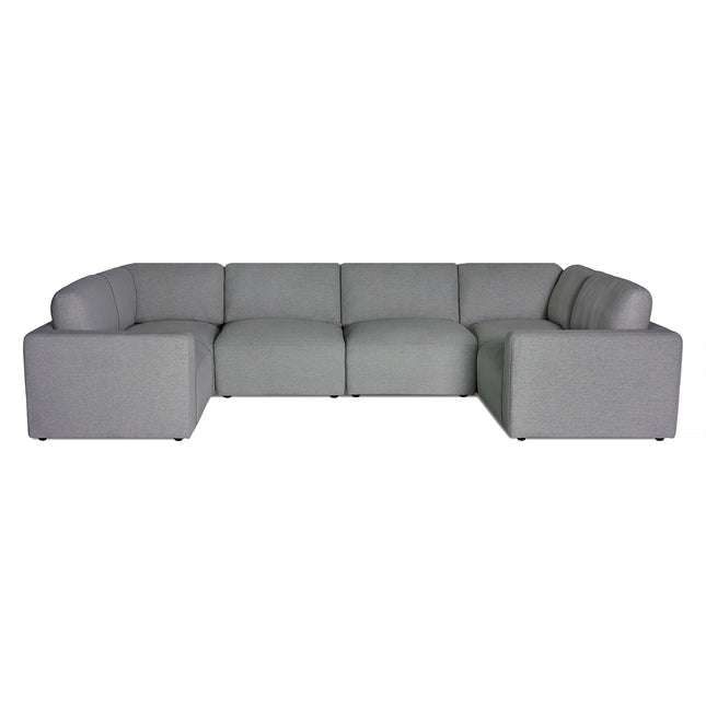 The Lugano Sectional is a luxurious gray L-shaped sofa with Italian-inspired modern design. It boasts clean lines and minimalism, making it ideal for contemporary living rooms. Plush cushions and neutral upholstery enhance its comfort and elegance.