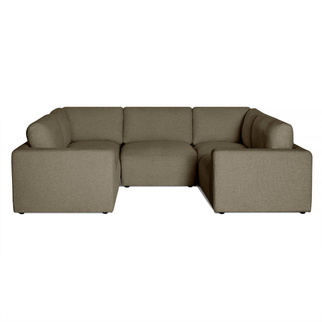 The Lugano sectional is an olive green U-shaped masterpiece featuring three pieces. It showcases plush cushions, low backs, and smooth fabric atop small black feet, perfectly embodying Italian luxury with an elegant touch.