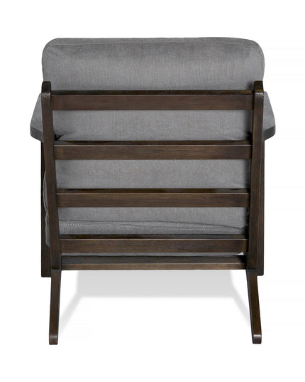 The Peyton Chair showcases a sleek rear view with dark brown slats and a cushioned backrest and seat upholstered in gray fabric. This mid-century style piece features a minimalist design with clean lines and a sturdy frame, perfectly blending elegance and comfort.