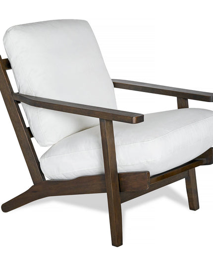 The Peyton Chair is a stylish wooden armchair with angular armrests and a dark brown frame, featuring a modern design with white cushioned back and seat for a contemporary, mid-century style look.