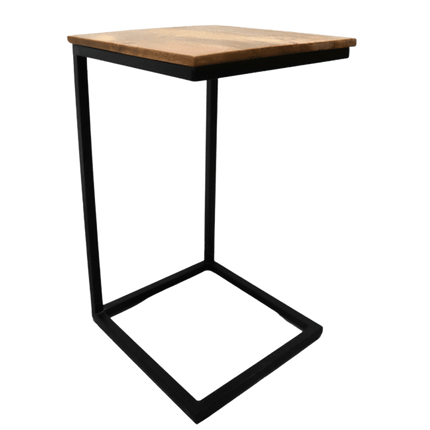 The Mango C-Table features a sustainable mango wood top and a black metal frame. Its modern C-shaped design has a simple, open structure for enhanced functionality, allowing it to conveniently slide over seating furniture.