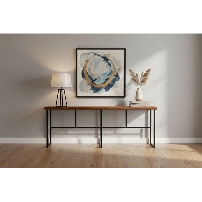 Rosewood Console styled in a modern entryway with framed artwork, a table lamp and pampas grass