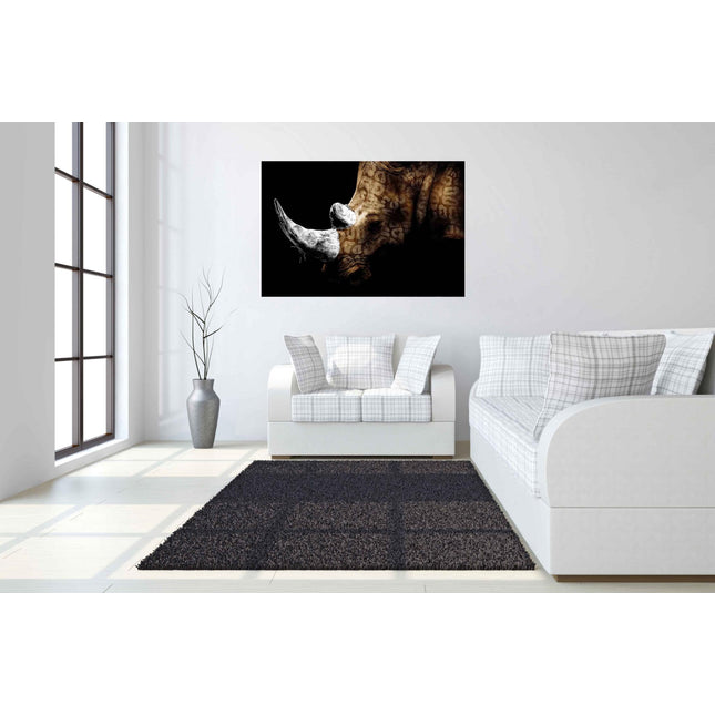 A modern living room features a plaid-patterned white sofa with cushions, a gray rug, and the Rhino artwork showcasing a rhinoceros on a black background. A tall vase with branches near the window lets natural light fill the space, creating a lasting impression.