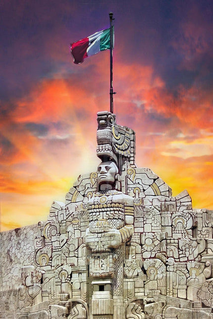 The Mexican Pride monument showcases intricate carvings and a large Mexican flag, set against a sunset sky. This stone structure features museum-quality artwork with indigenous motifs and a bold central figure, leaving a lasting impression on all who visit.