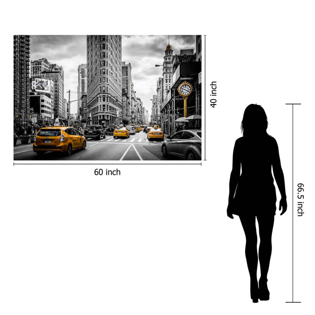 The NYC museum-quality artwork captures a city street with yellow taxis and towering buildings in black and white. Measuring 60 x 40, it features the silhouette of a woman standing at 66.5 for size comparison.