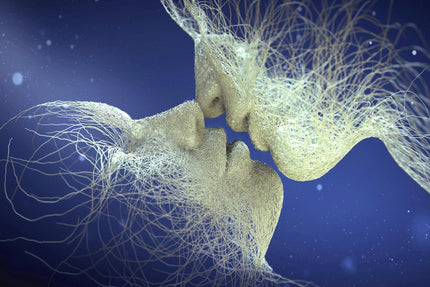 The Lasting Kiss artwork features two faces crafted from intertwining, translucent lines kissing against a dark blue background, evoking an ethereal connection and merging forms akin to figures in tempered glass.