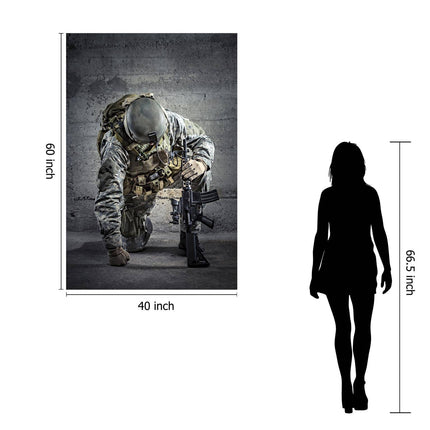 The Kneeling Soldier poster, measuring 60x40 inches, portrays a soldier in tactical gear and helmet crouched with a rifle. A 66.5-inch silhouette stands beside it for size comparison. This museum-quality artwork delivers a lasting impression with its striking detail.