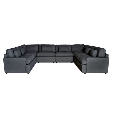 The My Cloud 8 Piece Pit is a large, dark gray L-shaped sofa with plush seating and multiple cushions, ideal for spacious living rooms. It features machine-washable fabric and is showcased on a plain white background.