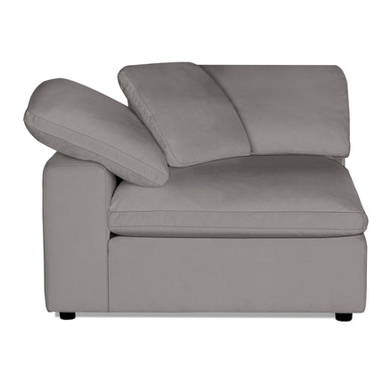 The Peyton Corner is a modern gray sectional sofa with a left-facing chaise, ideal for contemporary living spaces. It boasts plush cushions, a low profile, and premium quality. Its sleek design enhances todays home interiors effortlessly.
