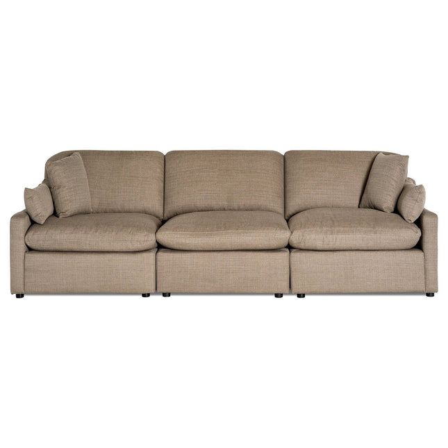 The My Cloud / Slope Arm is a beige, three-piece sectional with plush cushions and two matching throw pillows. Featuring straight lines and a low profile, this customizable sofa has machine-washable covers for easy upkeep, blending modern style with practicality.