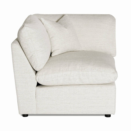 The My Cloud Slope Corner is a beige, L-shaped sectional featuring two large cushions and smaller pillows, crafted from textured fabric. This modular piece is versatile and beautifully showcased against a white background.