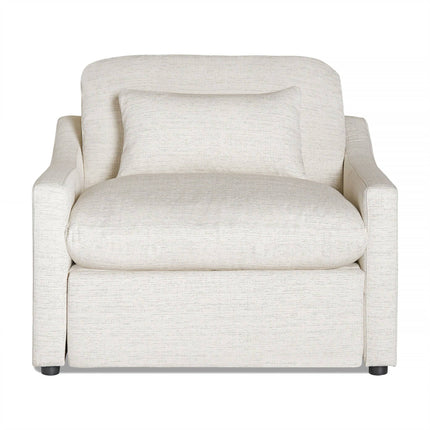 A cream-colored armchair with a matching pillow from My Cloud Slope Power Recliner graces the room. It features a plush, cushioned look with a slightly curved backrest, rectangular armrests, and subtly textured fabric for an elegant touch.