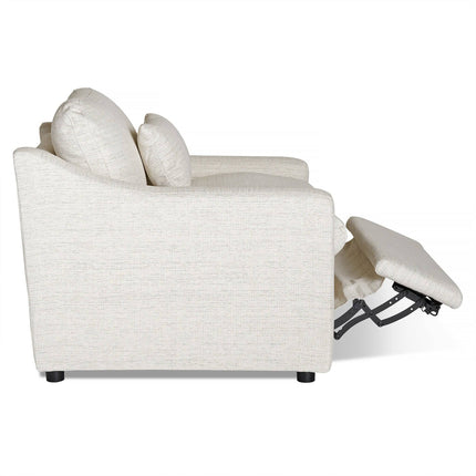 Side view of the My Cloud Slope Power Recliner, a light beige fabric-upholstered chair with an upright back and extended footrest. This customizable piece has rounded armrests and dark, short cylindrical legs.