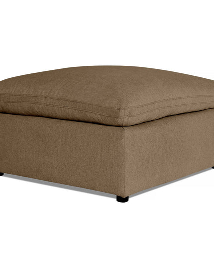 Introducing the My Cloud 40 Ottoman, a square, light brown piece with a cushioned top and black feet, set against a white background. This comfortable furniture boasts a simple, modern design perfect for use as a footrest or extra seating.