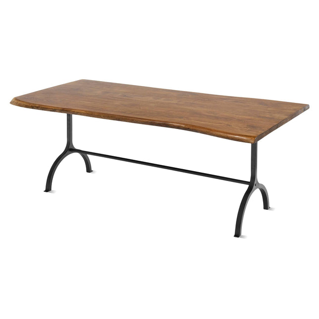 The Live Edge Foundry Dining Table features a rectangular acacia top with a natural, live edge on a minimalist metal frame. Its arched legs are connected by a horizontal bar, combining rustic and industrial styles.