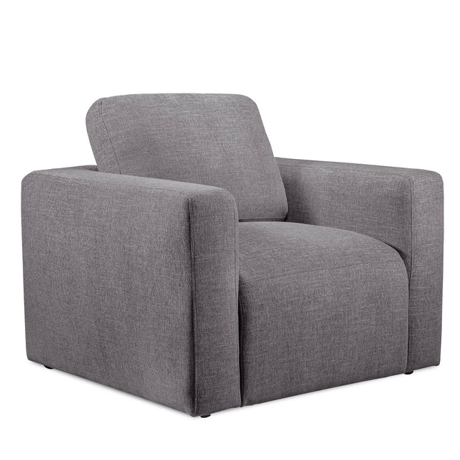 The Lugano Chair is a gray fabric armchair with a boxy design, wide armrests, and a cushioned backrest. Made from premium materials, it boasts a modern minimalist style that suits contemporary living spaces or the elegance of an Italian luxury setting.