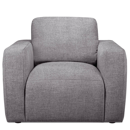 The Lugano Chair is a modern, gray upholstered armchair made from premium materials. It features wide armrests, a cushioned backrest, and a minimalist boxy design that reflects Italian luxury, making it ideal for contemporary interiors as part of the Lugano Sofa Set.
