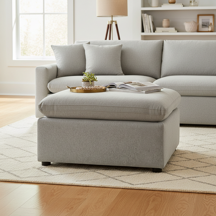 My Cloud 30 inch Ottoman in Greige staged in a cozy living room with matching sofa