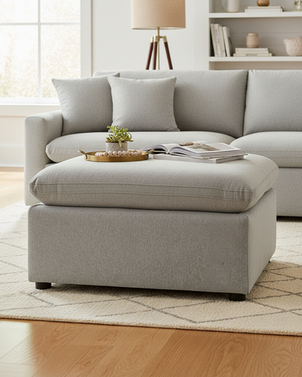 My Cloud 30 inch Ottoman in Greige staged in a cozy living room with matching sofa
