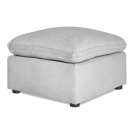 The My Cloud 30 Ottoman showcases a gray, plush cushion on a sturdy base with four black legs. This customizable piece combines minimalist design with comfort and style, perfect for any living space.