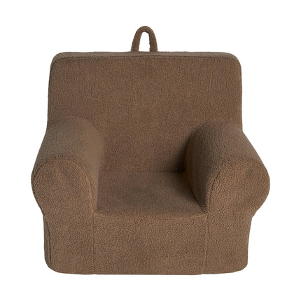 Meet the My Cloud Kidz Chair, a cozy brown childrens armchair made of plush Sherpa fabric. It features rounded armrests, a backrest, and a small loop handle on top for easy carrying, offering comfort and practicality in one design.