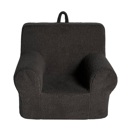 The My Cloud Kidz Chair is a dark gray childrens armchair with a soft Sherpa cover, curved armrests, and a sturdy backrest. Designed for convenience, it includes a loop handle for easy portability, ensuring its both stylish and functional in your little ones space.