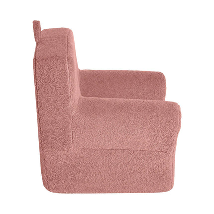 Side view of the My Cloud Kidz Chair, a plush childrens chair in pink with a high back and armrests. Made from cozy sherpa fabric, it provides teddy-bear-like comfort and is ideally sized for children.