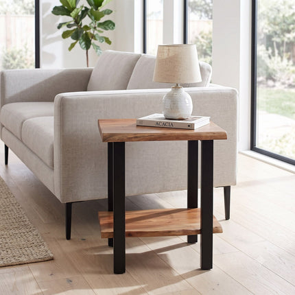 Live Edge acacia side table staged beside a sofa in a bright modern living room