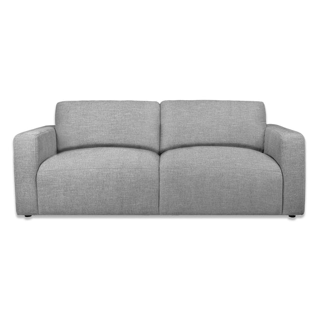 Meet the Lugano Sofa, a sleek modern gray fabric piece with plush cushions and wide armrests that captures Italian luxury. Crafted from premium materials, its minimalist design features dark, subtle legs—ideal for any contemporary living space.