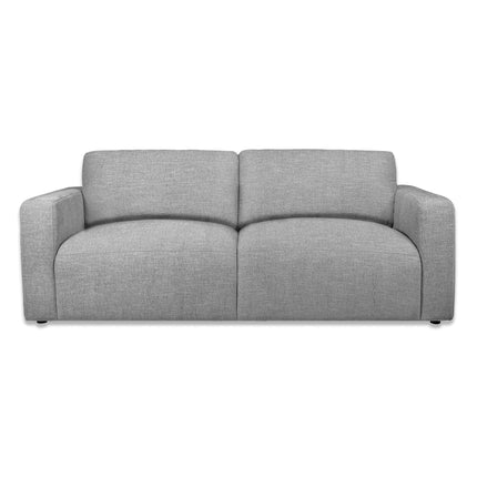 Meet the Lugano Sofa, a sleek modern gray fabric piece with plush cushions and wide armrests that captures Italian luxury. Crafted from premium materials, its minimalist design features dark, subtle legs—ideal for any contemporary living space.