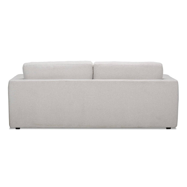 The light gray Lugano Sofa embodies Italian luxury with its minimalist design, featuring two rectangular back cushions and a solid, streamlined structure. Crafted from premium materials, it boasts clean lines and rests on discreet feet.