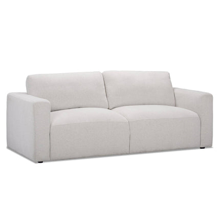 Discover the Italian luxury of the Lugano Sofa, a modern light gray design with wide armrests and two large cushions. Its minimalist style features smooth fabric and premium materials, creating a plush, cozy appearance against a plain white backdrop.