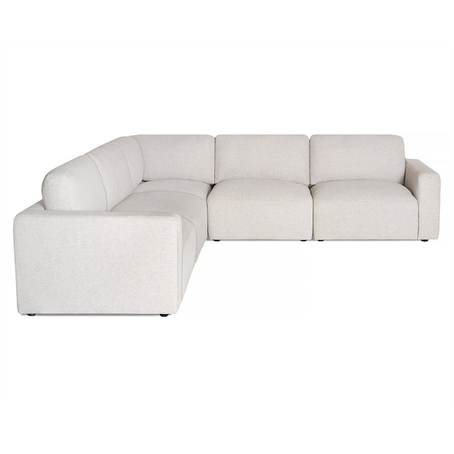 A large, light gray L-shaped sectional sofa with three seats on one side and two on the other features a minimalist design with square armrests and a low backrest, set against a plain white background. (Product: Free Fabric Swatches).