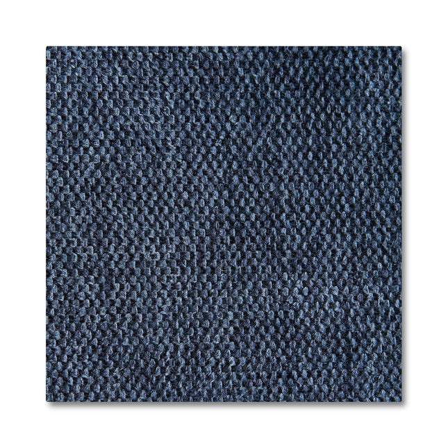 Close-up of a square piece of dark blue textured fabric, reminiscent of mid-century modern design, showing a detailed pattern of interwoven threads. The fabric appears slightly rough and durable, ideal for accentuating plush cushions on the Maddox Chair.