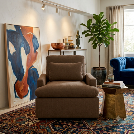 My Cloud Chair in Earth staged in an eclectic living room with gallery art