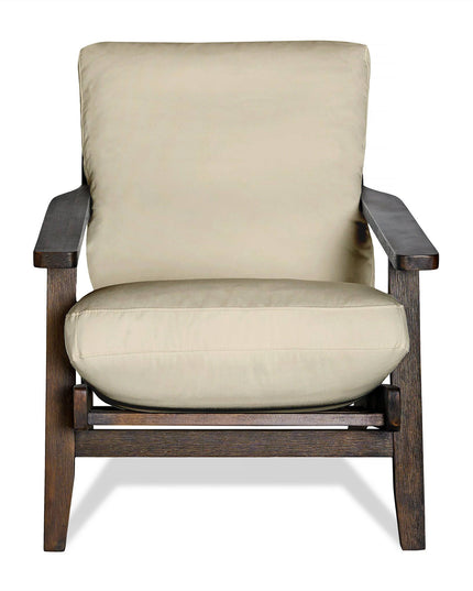 The Peyton Chair is a stylish, modern beige armchair with a dark wooden frame and mid-century design. It has thick armrests, a straight backrest, and plush cushions, ensuring comfort while maintaining minimalist elegance.
