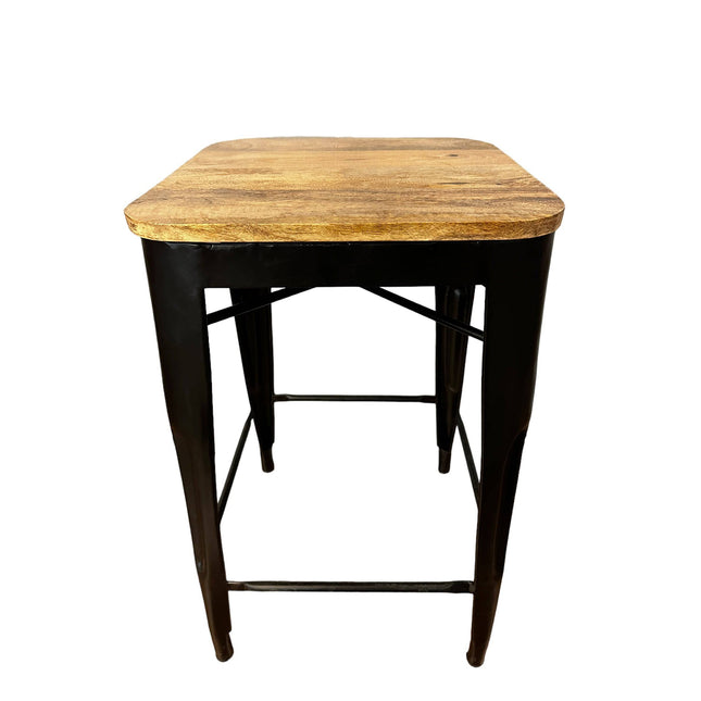 The Mango Counter Stool has a wooden top made from mango wood, sturdy black metal legs, and a crossbar for support, effortlessly combining simplicity with industrial design for your kitchen.