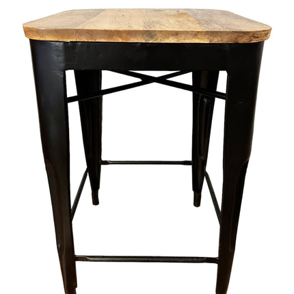The Mango Counter Stool features a square mango wood seat and black metal legs with a crossbar support for stability, blending rustic and modern elements. Perfect as a kitchen staple, it suits various interior styles with its industrial feel.