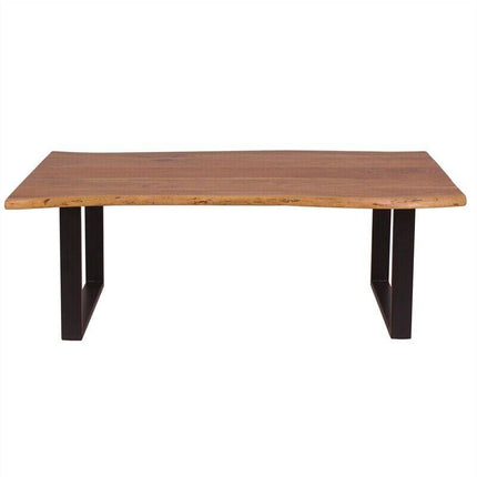 The Live Edge Coffee Table 1 Tier is wooden with a thick natural edge top made from one solid piece. It has two black metal legs in inverted U shapes, offering a modern and sturdy look.