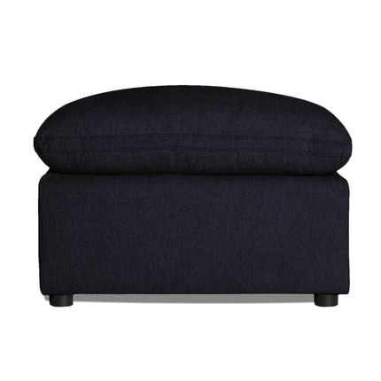 Set against a white backdrop, the My Cloud 30 Ottoman showcases a sleek black rectangular design with a cushioned top and small rounded legs, exemplifying customizable furniture that adapts effortlessly to any interior theme.