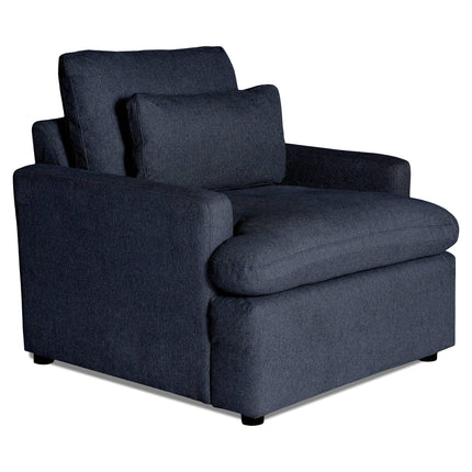 The My Cloud Chair is a dark gray cushioned armchair featuring a wide seat, padded armrests, and a matching back cushion. This comfortable furniture piece has a soft upholstered texture and rests on small black feet.