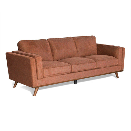 Presenting the Maddox Sofa, a mid-century modern gem with a rust hue. Featuring three plush cushions and a solid wooden frame with angled legs, it embodies classic retro appeal and exceptional comfort.